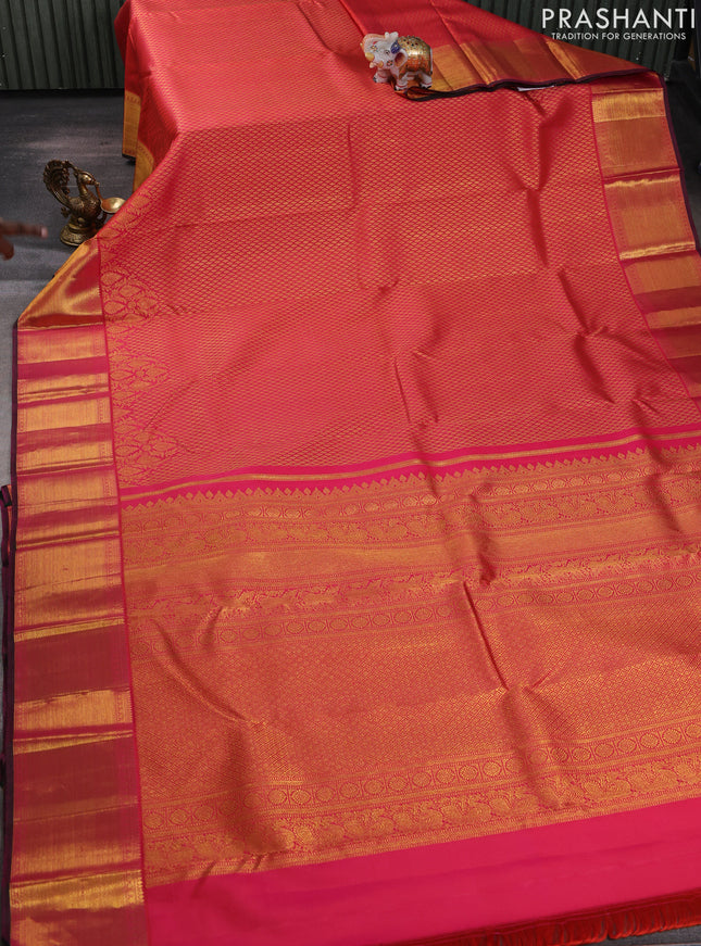 Pure kanchipuram silk saree dual shade of pinkish orange with allover zari woven brocade weaves and rich zari woven border