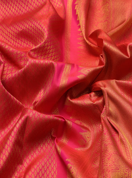 Pure kanchipuram silk saree dual shade of pinkish orange with allover zari woven brocade weaves and rich zari woven border