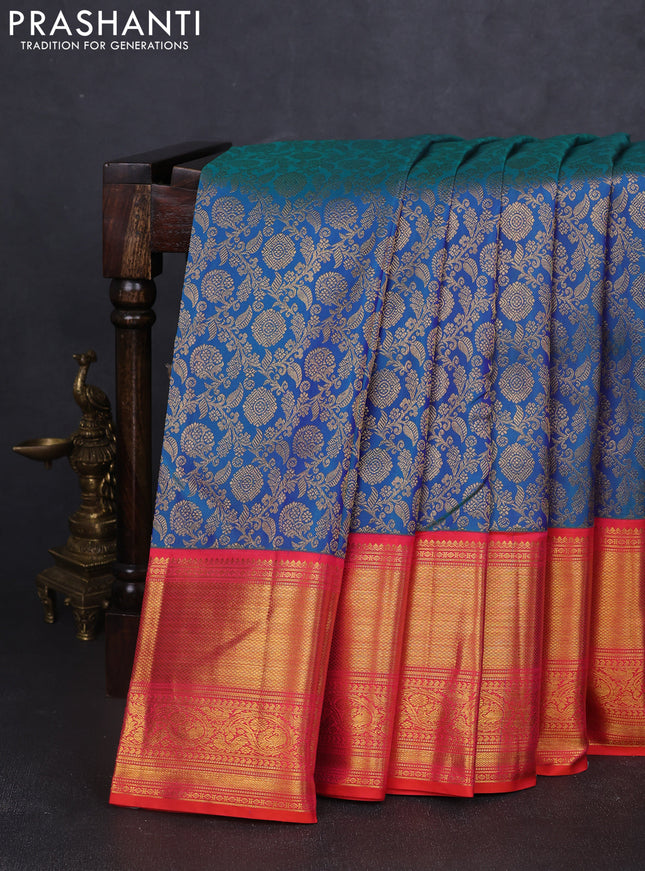 Pure kanchipuram silk saree dual shade of bluish green and dual shade of orange with allover zari woven brocade weaves and long rich zari woven border