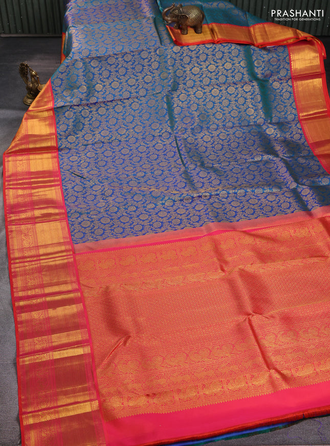 Pure kanchipuram silk saree dual shade of bluish green and dual shade of orange with allover zari woven brocade weaves and long rich zari woven border