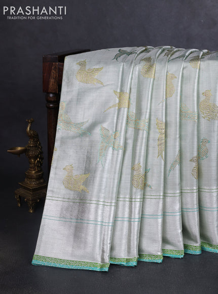 Pure tissue kanchipuram silk saree silver and green teal blue with allover zari woven peacock buttas and rich silver zari woven border