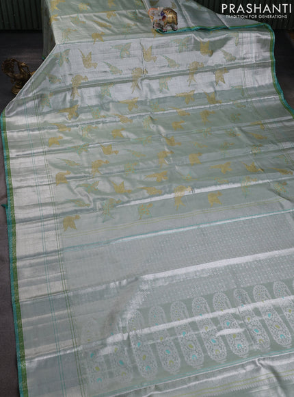 Pure tissue kanchipuram silk saree silver and green teal blue with allover zari woven peacock buttas and rich silver zari woven border