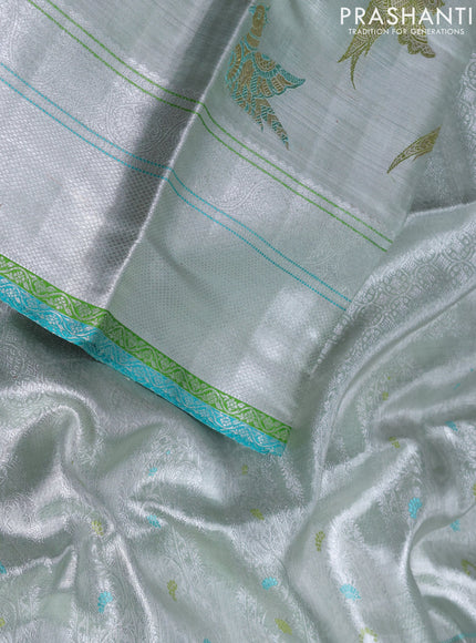Pure tissue kanchipuram silk saree silver and green teal blue with allover zari woven peacock buttas and rich silver zari woven border