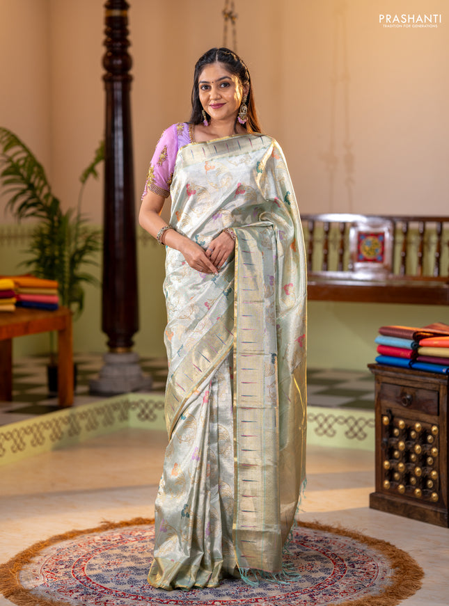 Pure tissue kanchipuram silk saree pastel green shade with allover zari weaves and zari woven muniya butta border