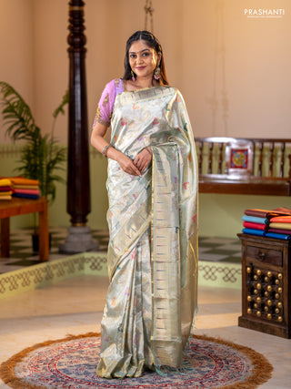 Pure tissue kanchipuram silk saree pastel green shade with allover zari weaves and zari woven muniya butta border