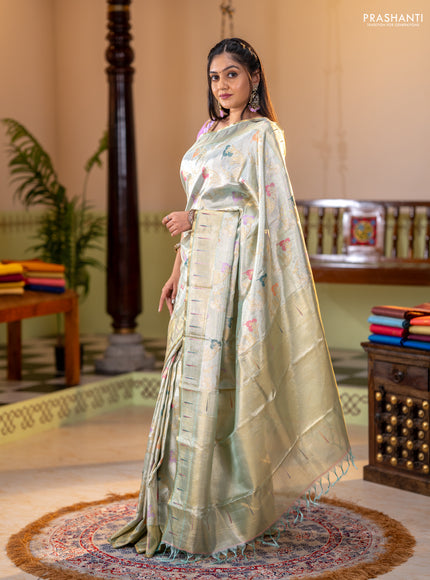Pure tissue kanchipuram silk saree pastel green shade with allover zari weaves and zari woven muniya butta border