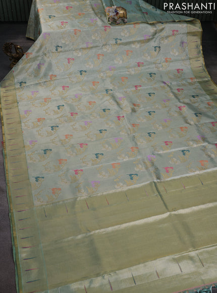 Pure tissue kanchipuram silk saree pastel green shade with allover zari weaves and zari woven muniya butta border