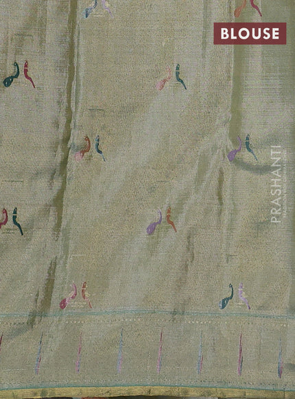 Pure tissue kanchipuram silk saree pastel green shade with allover zari weaves and zari woven muniya butta border