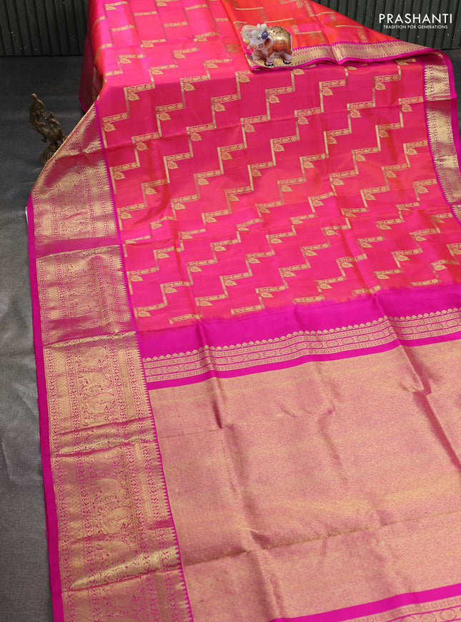 Venkatagiri silk saree dual shade of pinkish orange and pink with allover zig zag zari weaves and long zari woven border