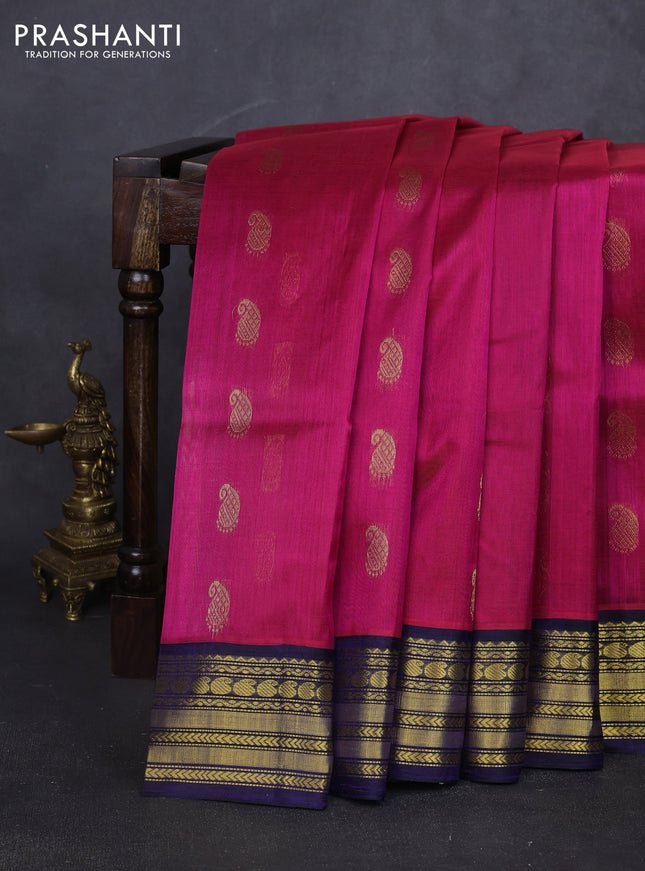 Kuppadam silk cotton saree pink and navy blue with allover paisely zari woven buttas and temple design zari woven border