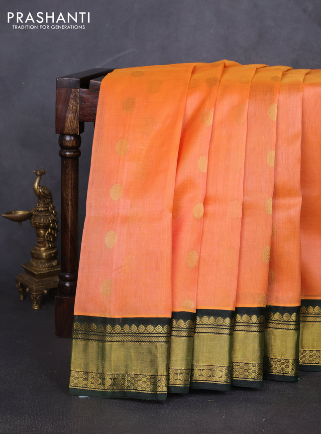 Kuppadam silk cotton saree peach orange and bottle green with allover zari woven buttas and rettapet zari woven border