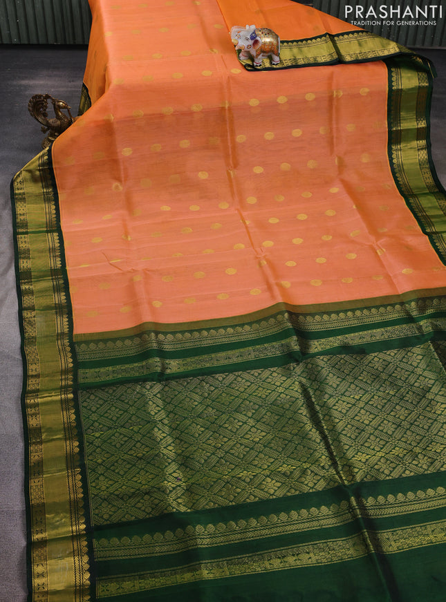 Kuppadam silk cotton saree peach orange and bottle green with allover zari woven buttas and rettapet zari woven border
