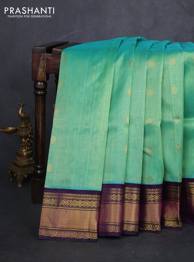 Kuppadam silk cotton saree teal green and purple with plain body and rettapet zari woven border