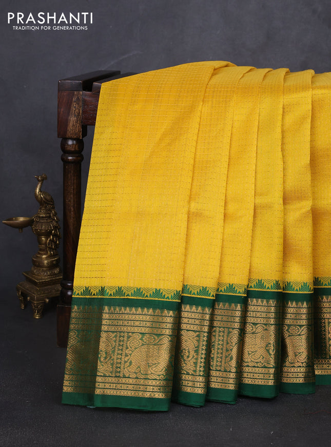 Kuppadam silk cotton saree yellow and green with allover laksha deepam pattern and temple design elephant zari woven border