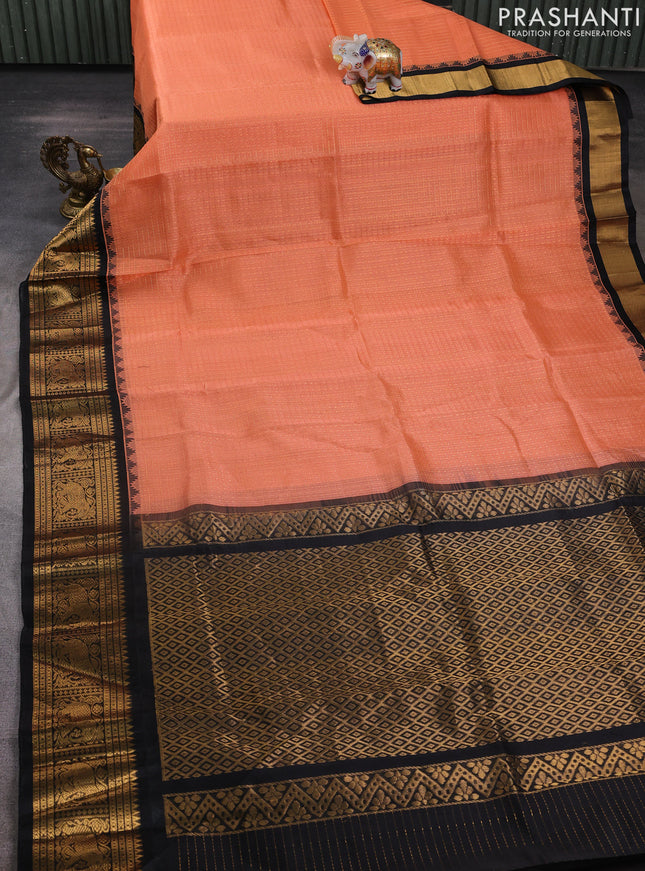 Kuppadam silk cotton saree peach orange and black with allover laksha deepam pattern and temple design elephant zari woven border