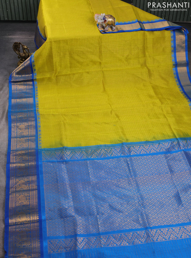 Kuppadam silk cotton saree lime yellow and cs blue with allover laksha deepam pattern and temple design elephant zari woven border
