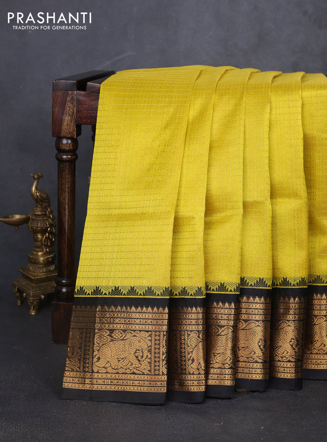 Kuppadam silk cotton saree lime yellow and black with allover laksha deepam pattern and temple design elephant zari woven border
