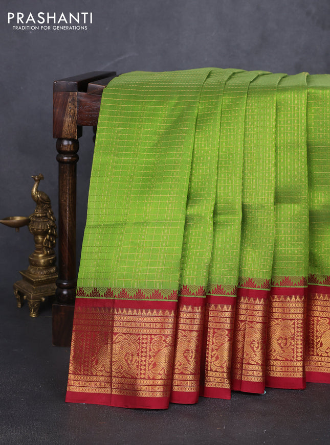 Kuppadam silk cotton saree light green and maroon with allover laksha deepam pattern and temple design elephant zari woven border