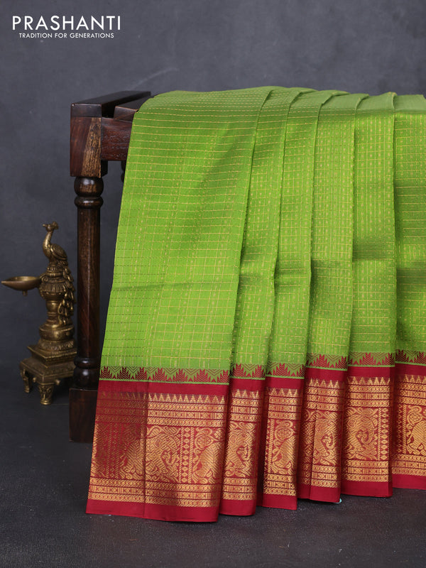 Kuppadam silk cotton saree light green and maroon with allover laksha deepam pattern and temple design elephant zari woven border