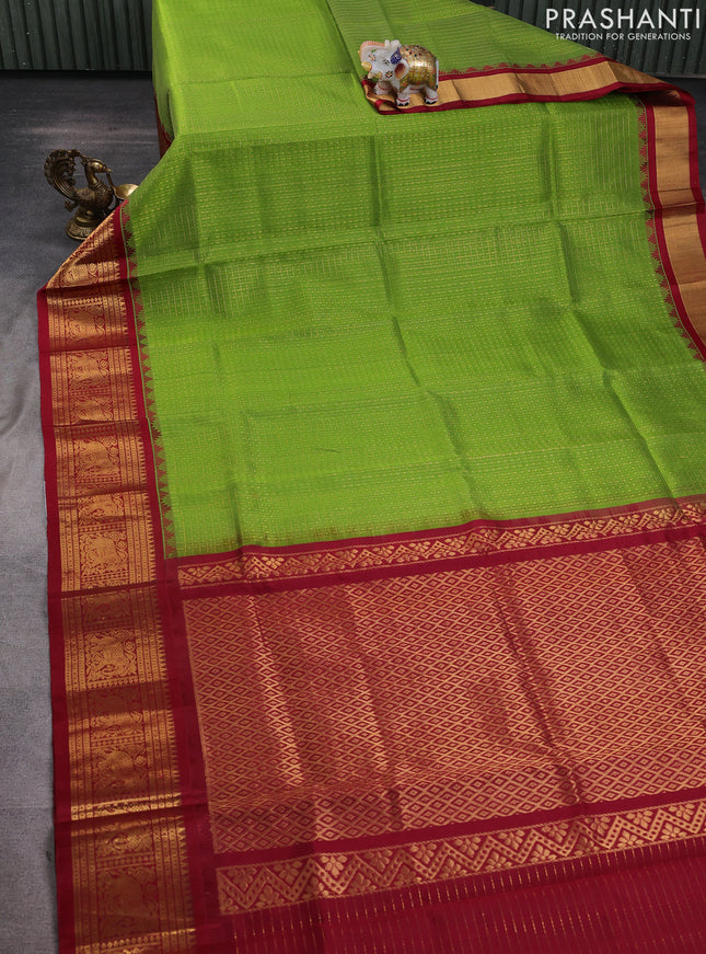 Kuppadam silk cotton saree light green and maroon with allover laksha deepam pattern and temple design elephant zari woven border