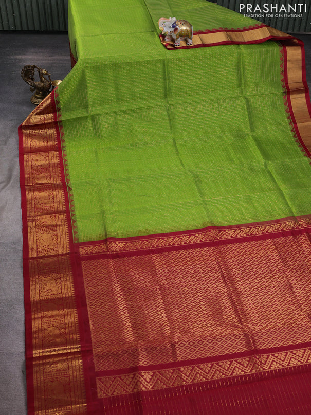 Kuppadam silk cotton saree light green and maroon with allover laksha deepam pattern and temple design elephant zari woven border