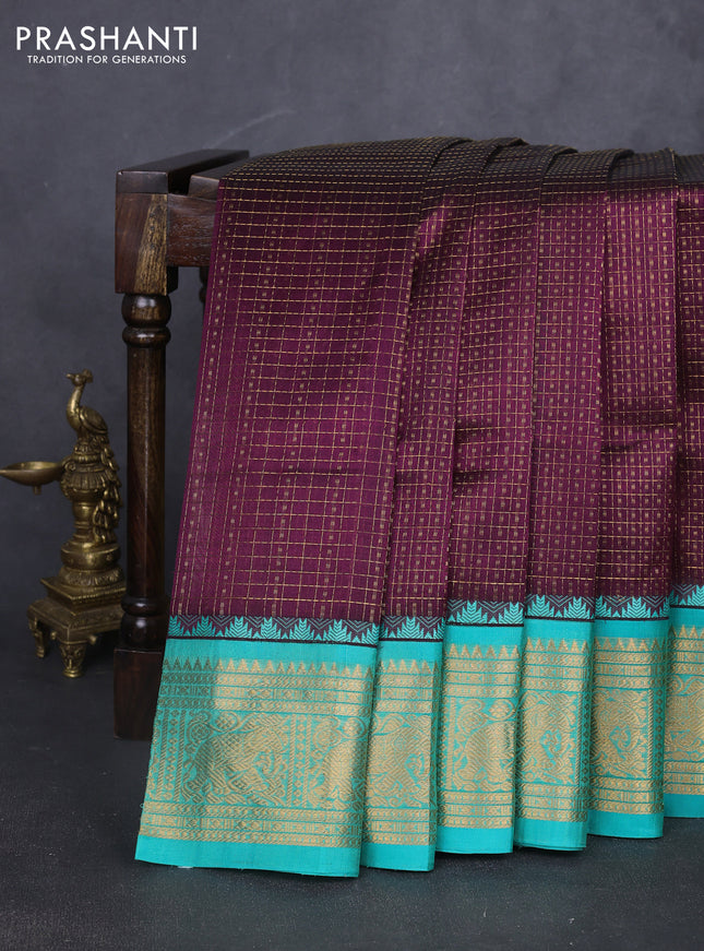 Kuppadam silk cotton saree deep purple and teal green with allover laksha deepam pattern and temple design elephant zari woven border