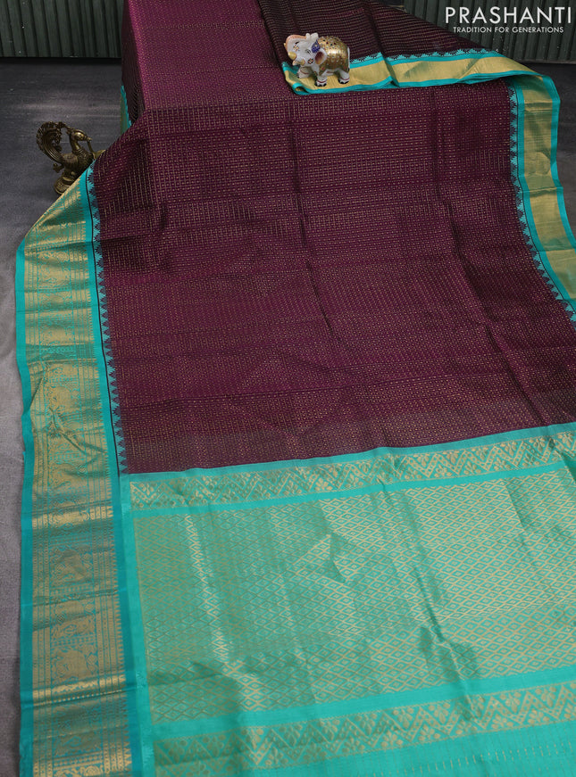 Kuppadam silk cotton saree deep purple and teal green with allover laksha deepam pattern and temple design elephant zari woven border