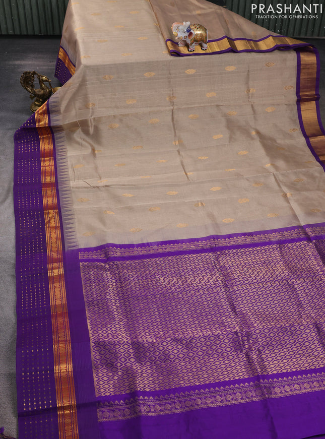 Kuppadam silk cotton saree beige and violet with allover zari woven buttas and zari woven border
