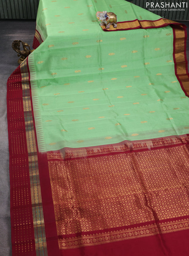 Kuppadam silk cotton saree pista green and deep maroon with allover zari woven buttas and zari woven border