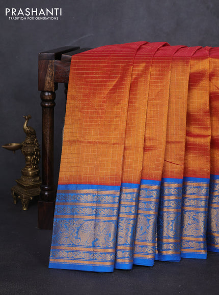 Kuppadam silk cotton saree rust shade and cs blue with allover zari checked pattern and long zari woven border