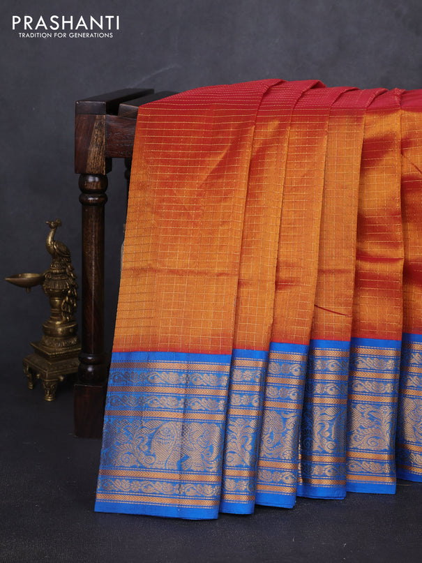 Kuppadam silk cotton saree rust shade and cs blue with allover zari checked pattern and long zari woven border