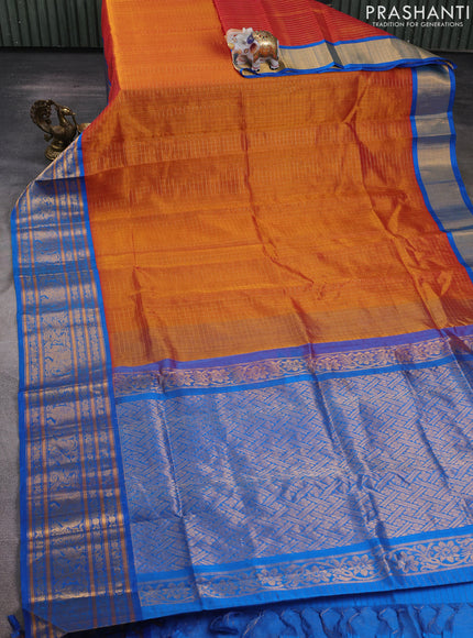 Kuppadam silk cotton saree rust shade and cs blue with allover zari checked pattern and long zari woven border