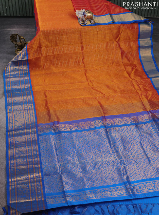 Kuppadam silk cotton saree rust shade and cs blue with allover zari checked pattern and long zari woven border