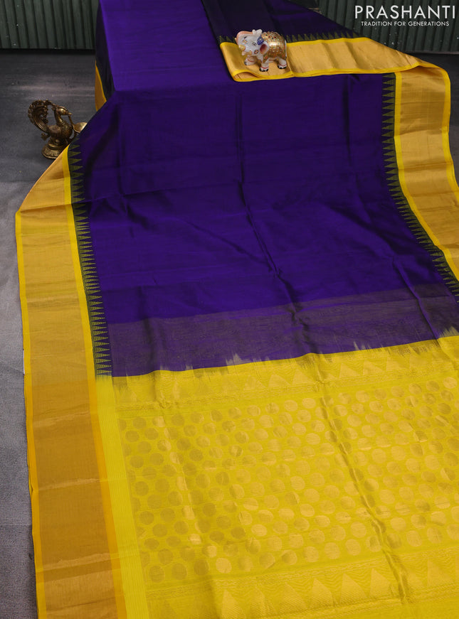 Kuppadam silk cotton saree navy blue and yellow with plain body and temple design zari woven border