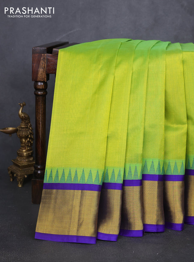 Kuppadam silk cotton saree light green and violet with plain body and temple design zari woven border