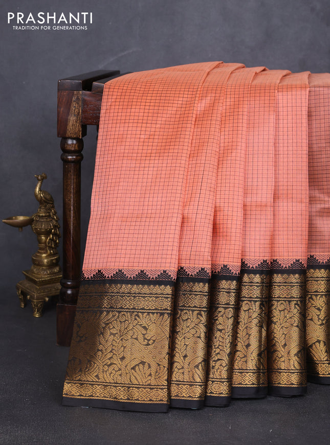Kuppadam silk cotton saree peach shade and black with allover small thread checked pattern and long zari woven border