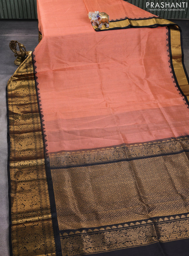 Kuppadam silk cotton saree peach shade and black with allover small thread checked pattern and long zari woven border