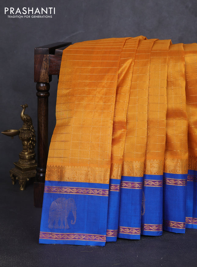 Kuppadam silk cotton saree mustard yellow and cs blue with allover zari checked pattern and rettapet zari woven butta border