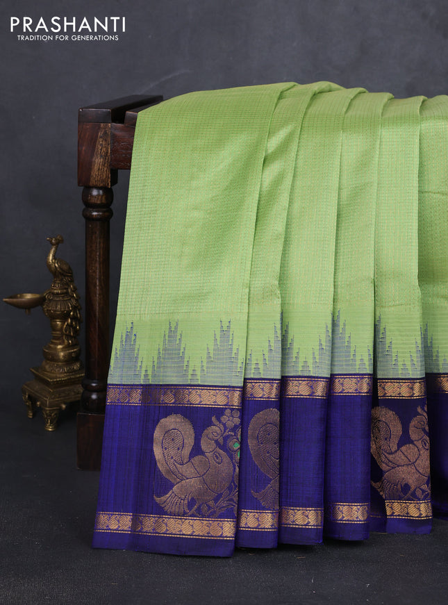 Kuppadam silk cotton saree pista green and navy blue with allover small zari checked pattern and rettapet zari woven butta border