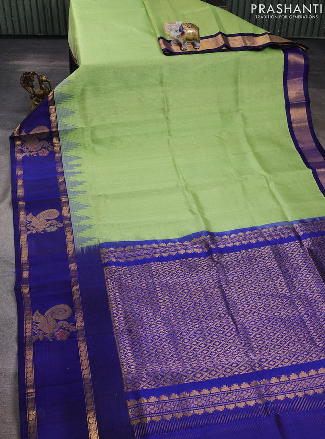 Kuppadam silk cotton saree pista green and navy blue with allover small zari checked pattern and rettapet zari woven butta border