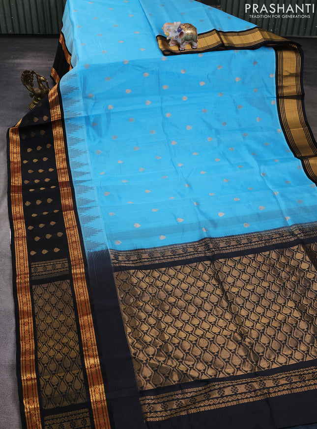 Kuppadam silk cotton saree light blue and black with zari woven thilak buttas and long temple design zari woven border