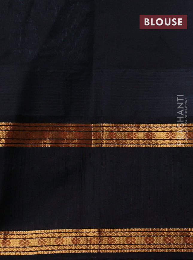 Kuppadam silk cotton saree light blue and black with zari woven thilak buttas and long temple design zari woven border