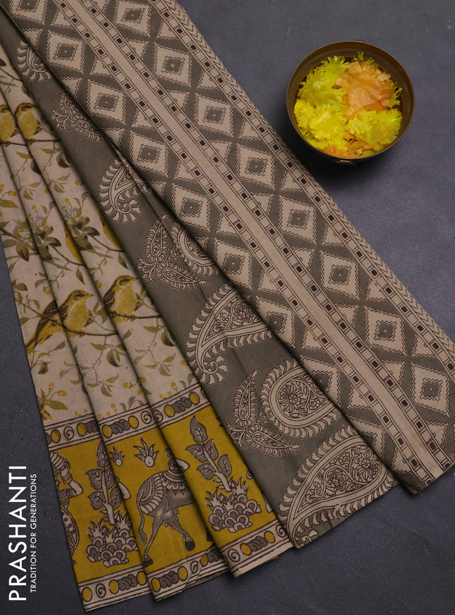 Kalamkari cotton saree beige and yellow with allover prints and printed border