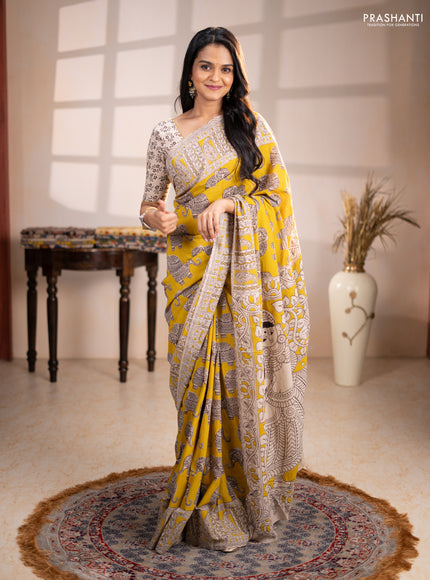 Kalamkari cotton saree yellow and beige with allover butta prints and printed border