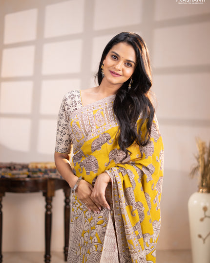 Kalamkari cotton saree yellow and beige with allover butta prints and printed border