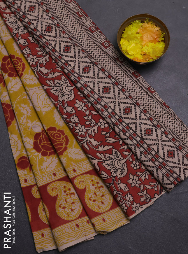 Kalamkari cotton saree yellow and rust shade with allover prints and printed border