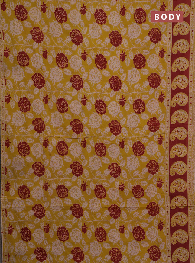 Kalamkari cotton saree yellow and rust shade with allover prints and printed border
