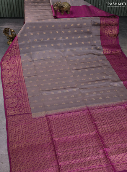 Kanchipuram soft silk saree pastel brown and magenta pink with allover zari woven buttas and long zari woven border