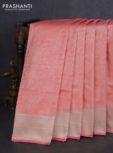 Banarasi semi katan silk saree peach shade with allover floral self emboss and zari woven border
