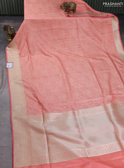 Banarasi semi katan silk saree peach shade with allover floral self emboss and zari woven border